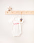 Personalised Christmas Baby Grow | Ho Ho Ho Organic Cotton - Cashmere Duck